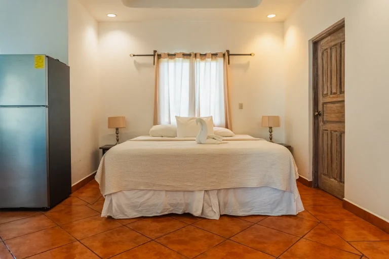 Comfortable master bedroom at La Jolla de Guasacate apartments, Nicaragua, featuring a king-size bed