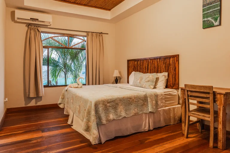 Overall view of the sleeping area with bed and tiled floors in a Studio with kitchen in Guasacate, Nicaragua.